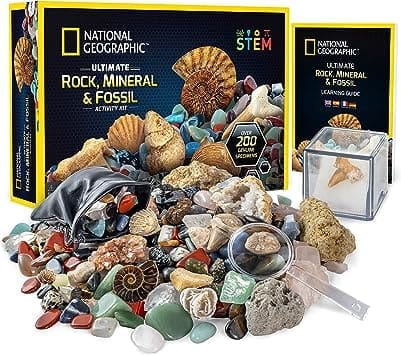 Image of the National Geographic Rocks & Fossils Kit, a 200+ piece set including geodes, real fossils, and various types of rocks, crystals, and gems such as rose quartz, jasper, and aventurine.