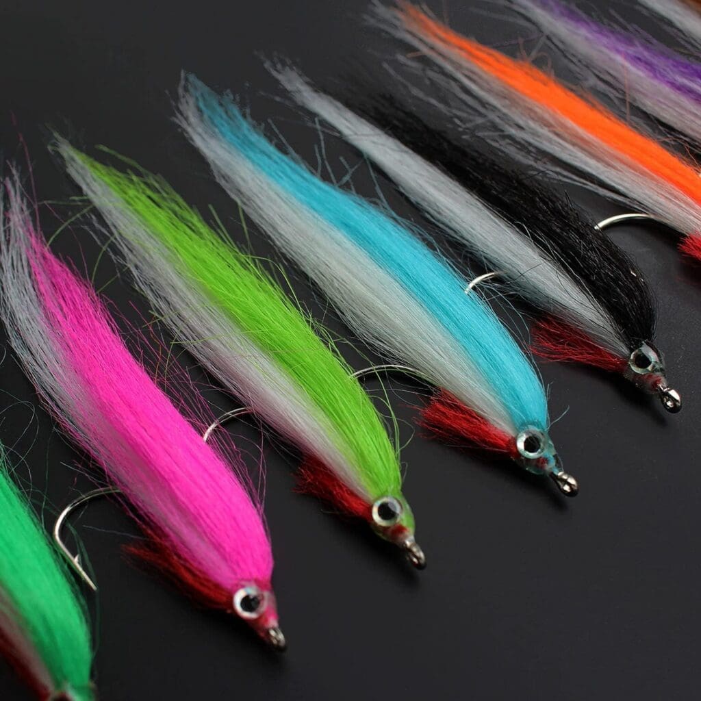 Tigofly streamer flies in yellow, orange, blue, green, and purple, rated 4.2/5, for salmon, trout, and sea bass fly fishing.